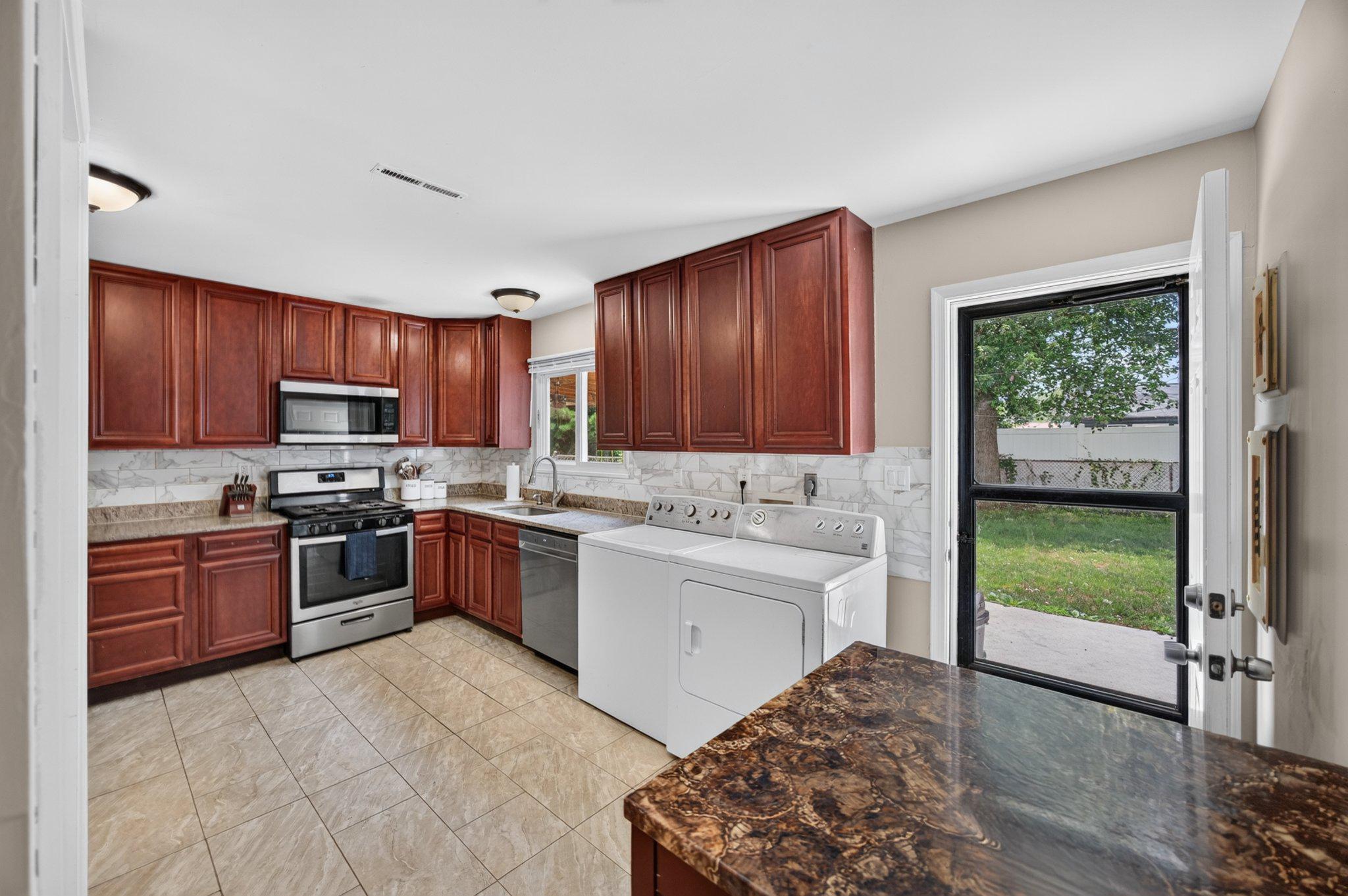 2106 North Rolling Road Windsor Mill, MD 21244 - Photo 11 of 24 Kitchen has access to new back patio