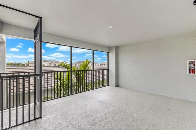 a view of a big room with windows