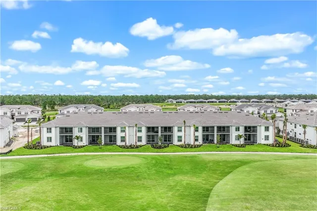 a view of a big yard with table and chairs and plants