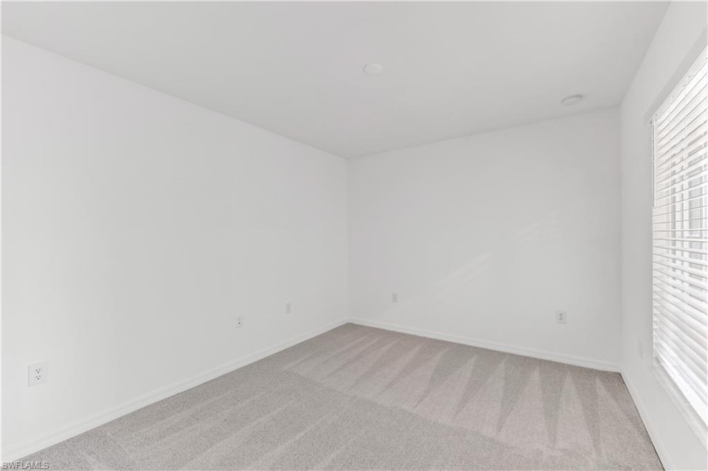 15950 Grassland Lane, Unit 2623 Babcock Ranch, FL 33982 - Photo 5 of 16 an empty room with a window