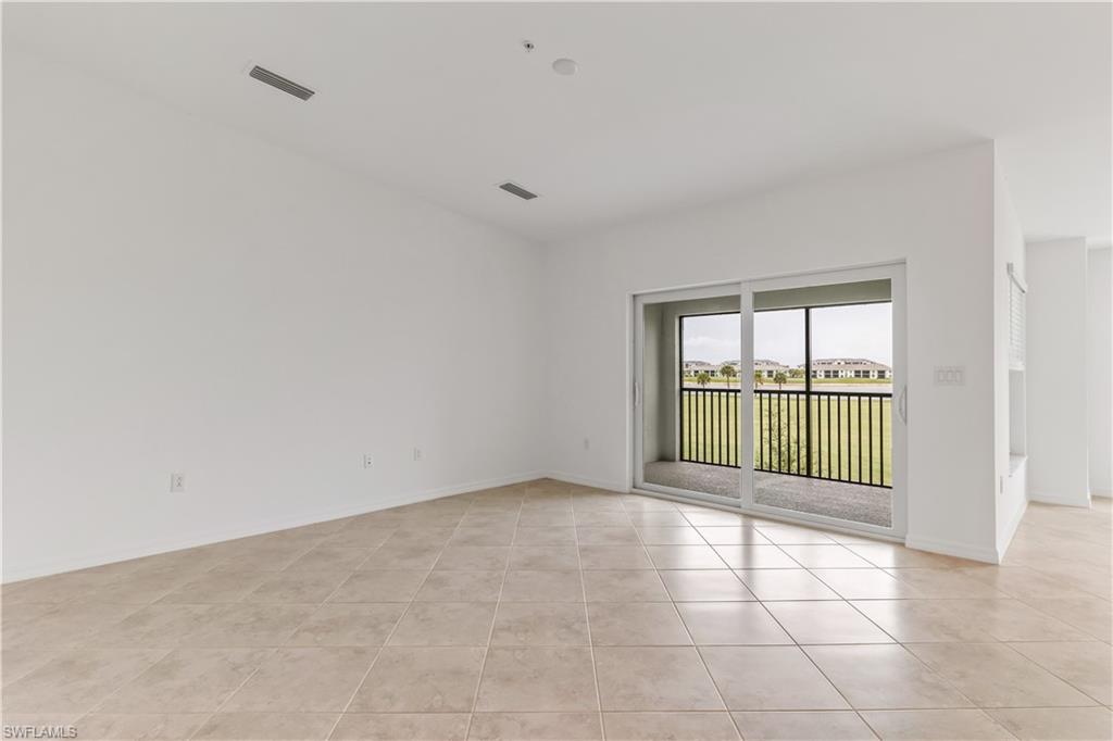 15950 Grassland Lane, Unit 2623 Babcock Ranch, FL 33982 - Photo 9 of 16 a view of an empty room with a window