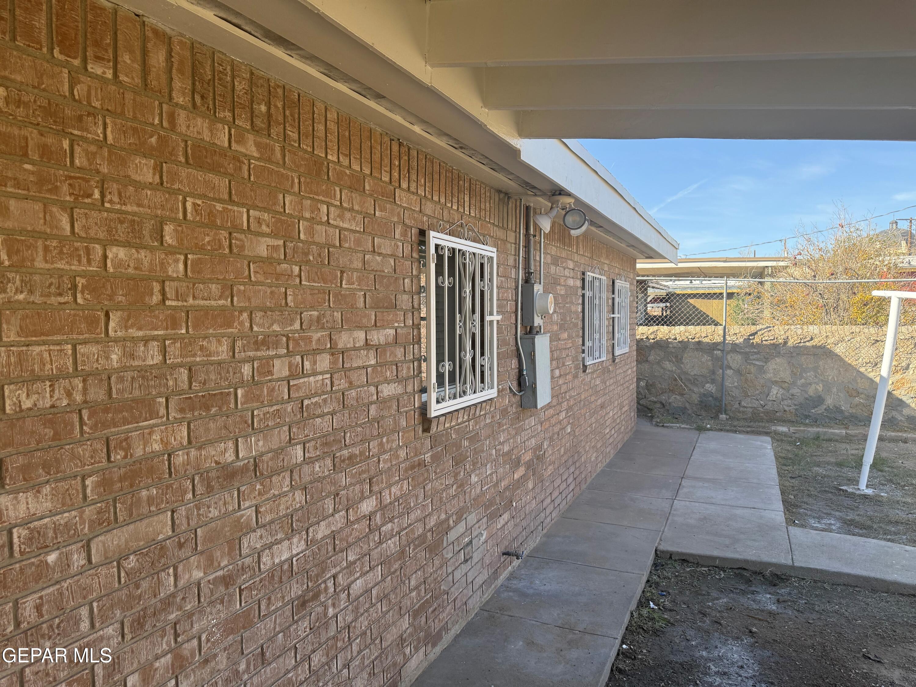 6227 Algonquin Road El Paso, TX 79905 - Photo 13 of 14 a view of a brick wall with two windows