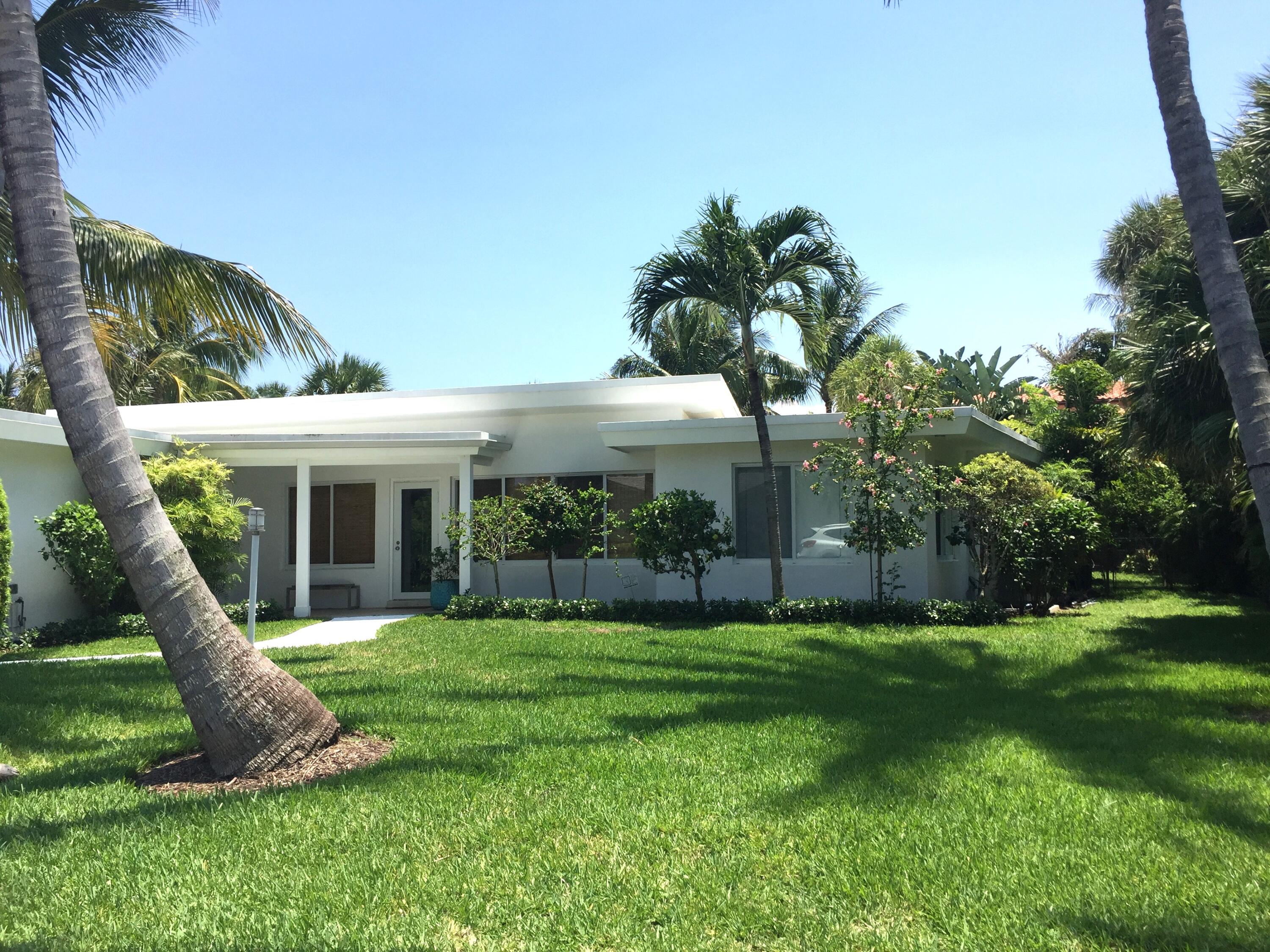 145 Beacon Lane Jupiter Inlet Colony, FL 33469 - Photo 1 of 15 a view of a house with a yard and furniture