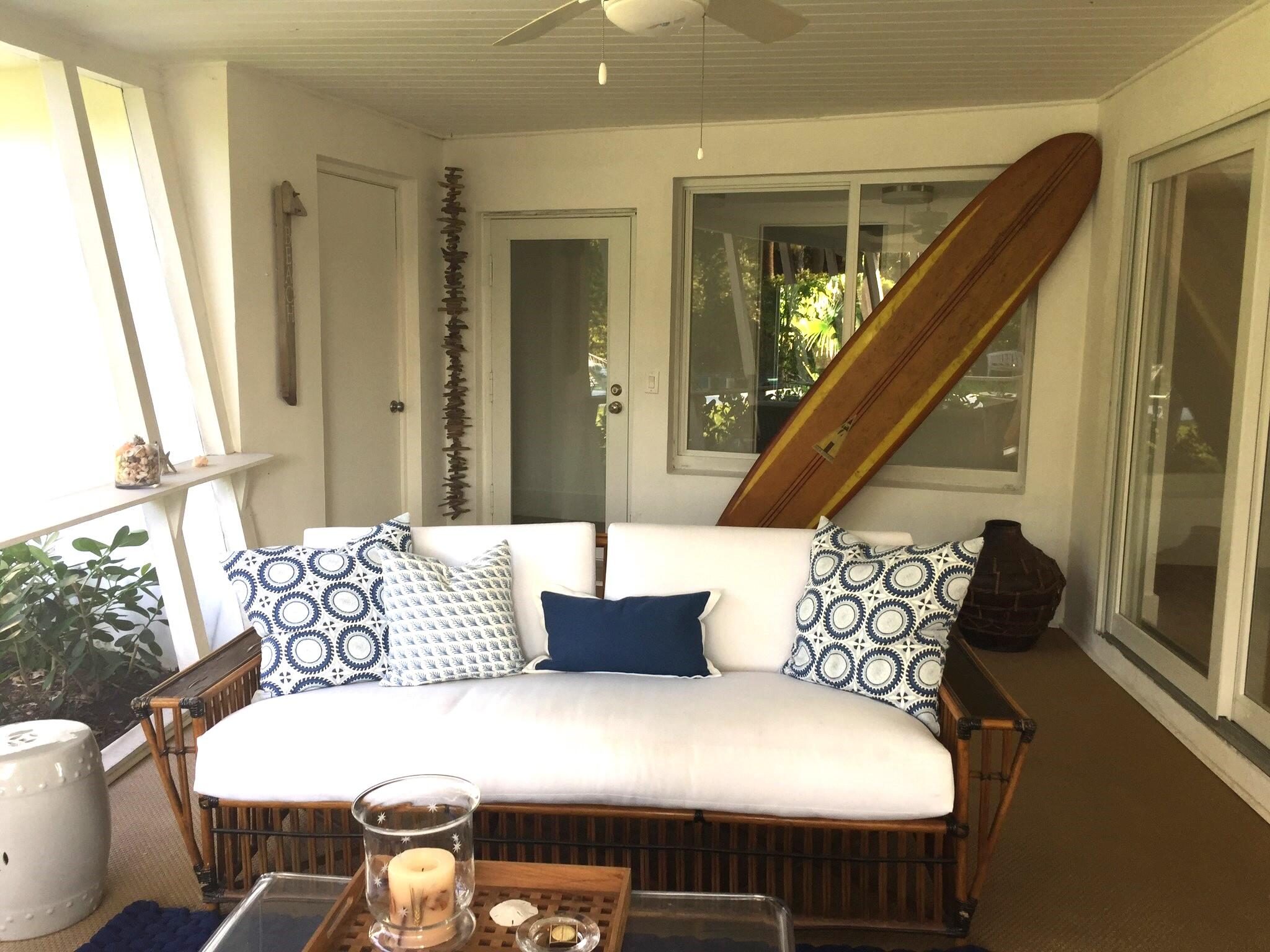 145 Beacon Lane Jupiter Inlet Colony, FL 33469 - Photo 9 of 15 a bedroom with furniture and a large window