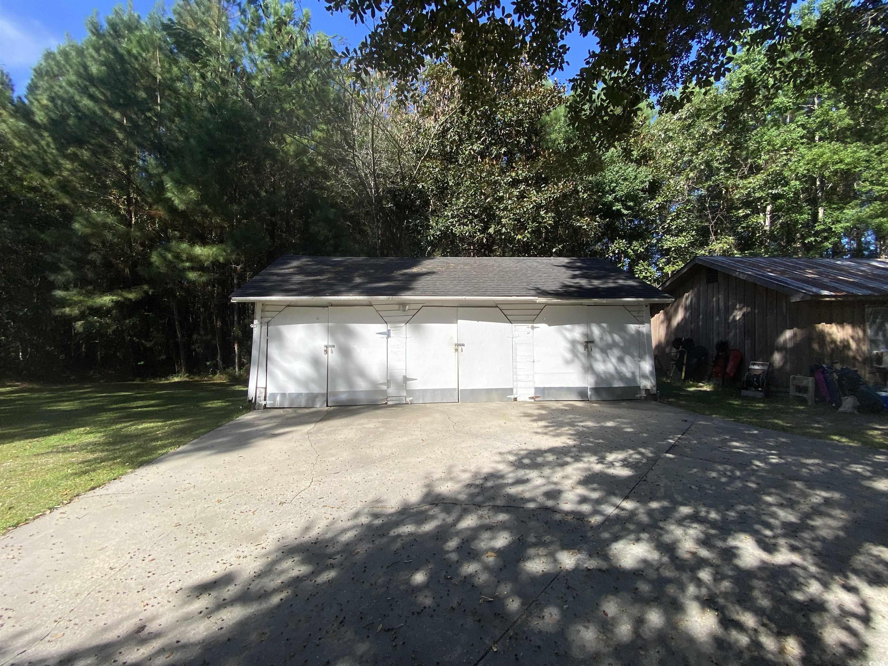 2593 Long Ave Extension Conway, SC 29526 - Photo 16 of 40 Garage with view of scattered trees
