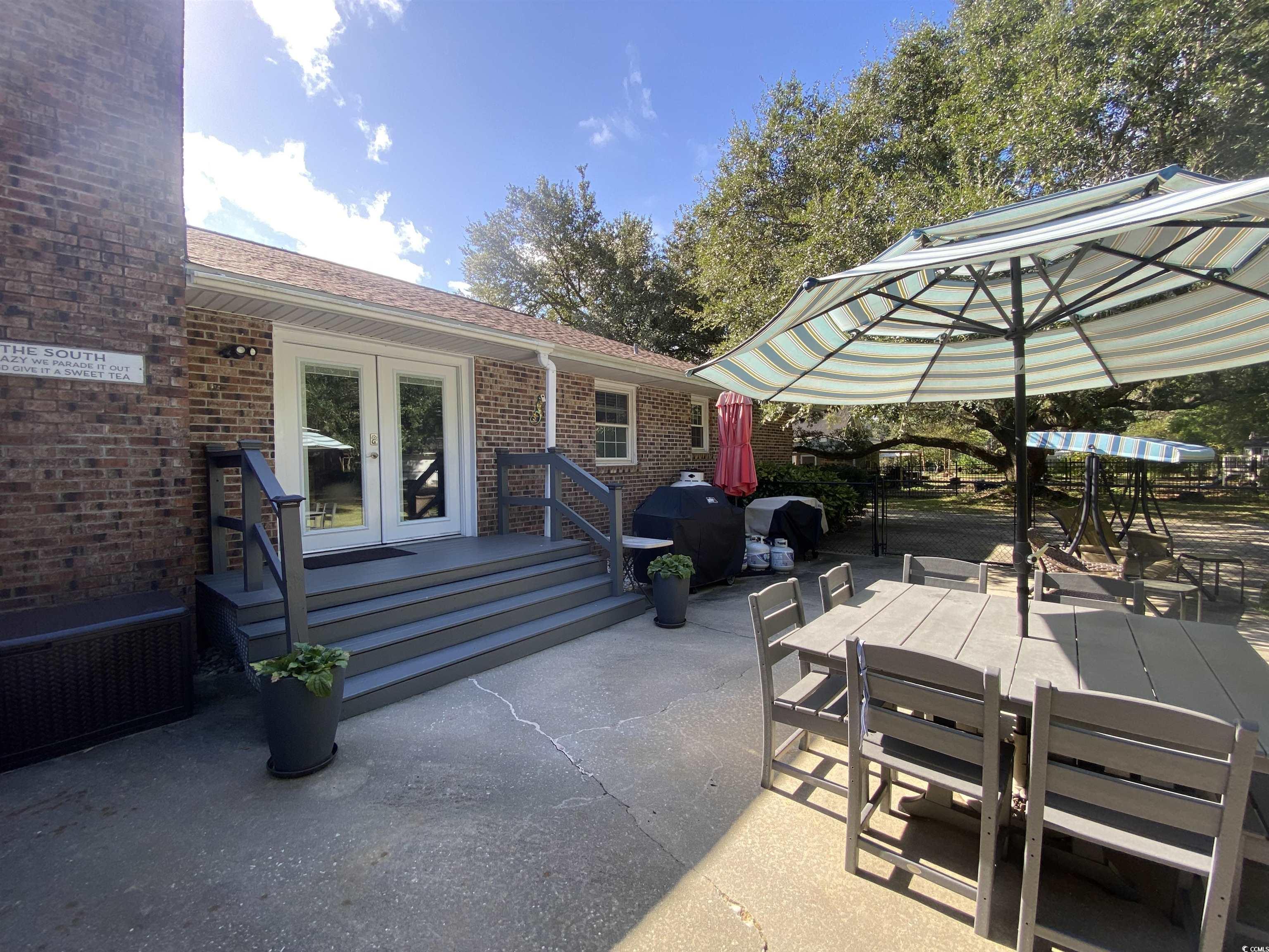 2593 Long Ave Extension Conway, SC 29526 - Photo 6 of 40 View of patio featuring outdoor dining space, french doors, and grilling area