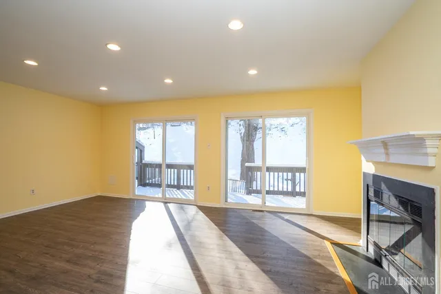 a view of an entryway with wooden floor