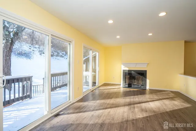 a view of empty room with floor to ceiling window