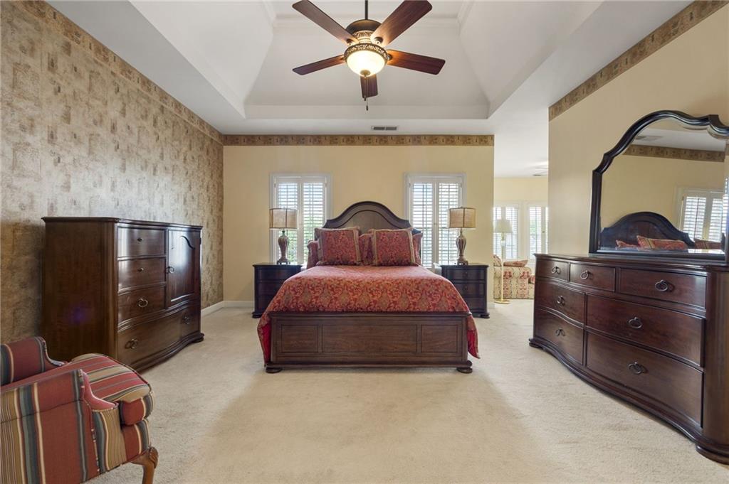 4727 Ivy Ridge Drive Southeast Atlanta, GA 30339 - Photo 12 of 35 a bedroom with a bed and wooden floor