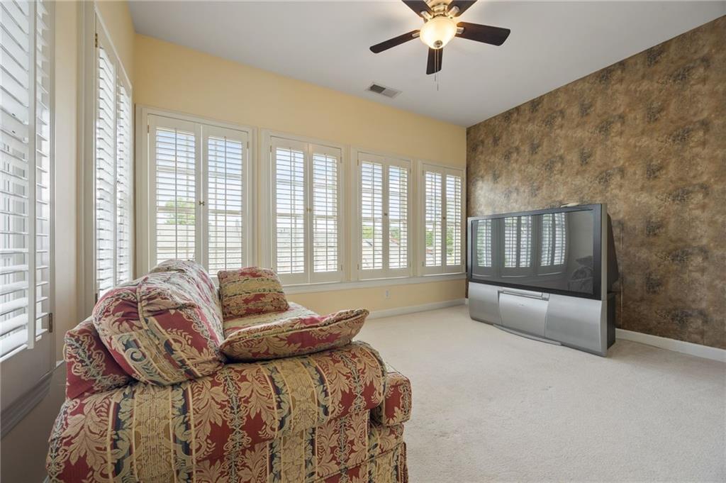 4727 Ivy Ridge Drive Southeast Atlanta, GA 30339 - Photo 14 of 35 a bedroom with a bed and a couch