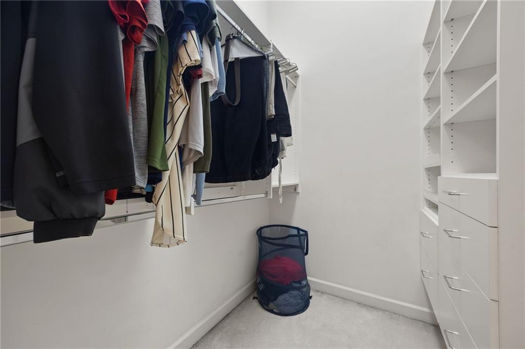 4727 Ivy Ridge Drive Southeast Atlanta, GA 30339 - Photo 18 of 35 a view of walk in closet with clothes and shoes