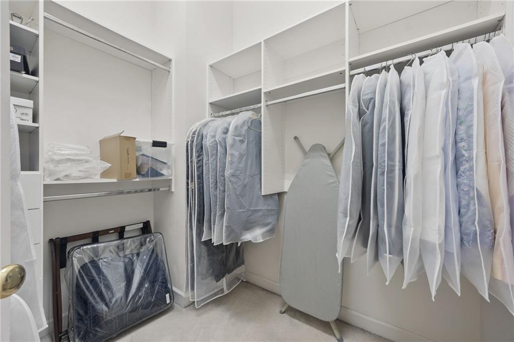 4727 Ivy Ridge Drive Southeast Atlanta, GA 30339 - Photo 19 of 35 a walk in closet with a mirror