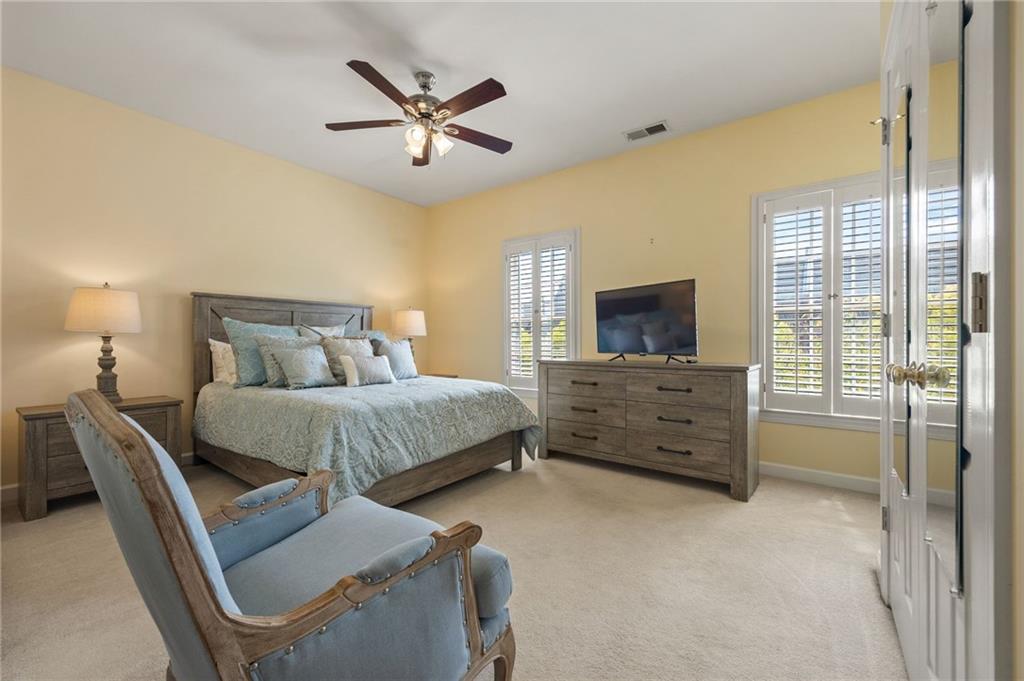 4727 Ivy Ridge Drive Southeast Atlanta, GA 30339 - Photo 20 of 35 a bedroom with a bed and a flat screen tv