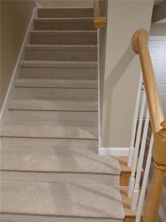 4727 Ivy Ridge Drive Southeast Atlanta, GA 30339 - Photo 26 of 35 a view of staircase with white walls and a window