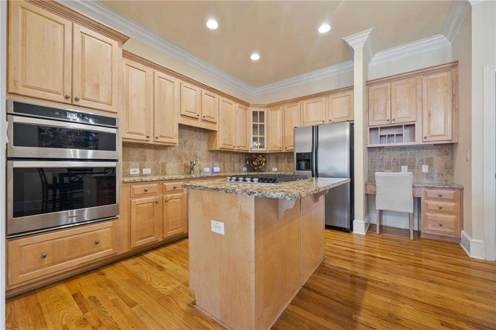 4727 Ivy Ridge Drive Southeast Atlanta, GA 30339 - Photo 6 of 35 a kitchen with stainless steel appliances granite countertop a refrigerator sink and cabinets