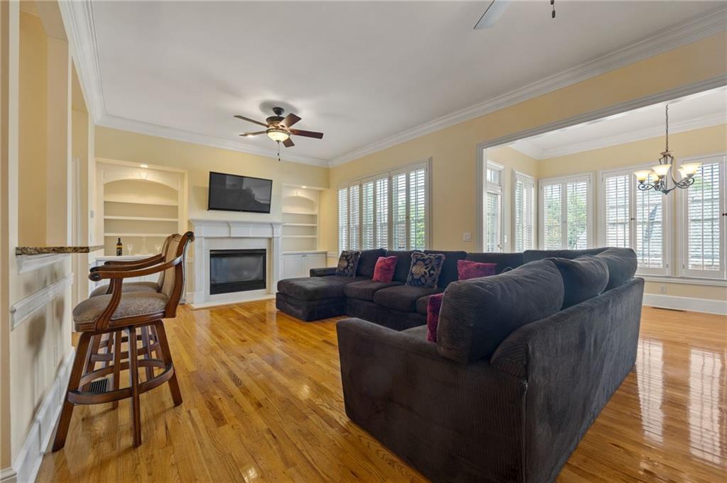 4727 Ivy Ridge Drive Southeast Atlanta, GA 30339 - Photo 7 of 35 a living room with furniture fireplace and flat screen tv