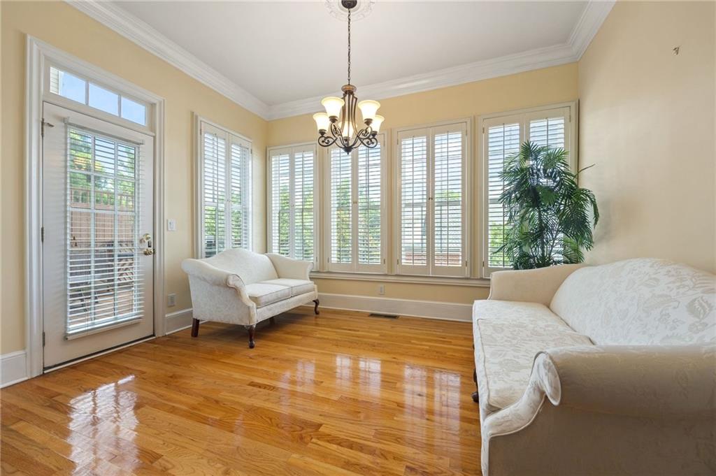 4727 Ivy Ridge Drive Southeast Atlanta, GA 30339 - Photo 9 of 35 a living room with furniture and a chandelier