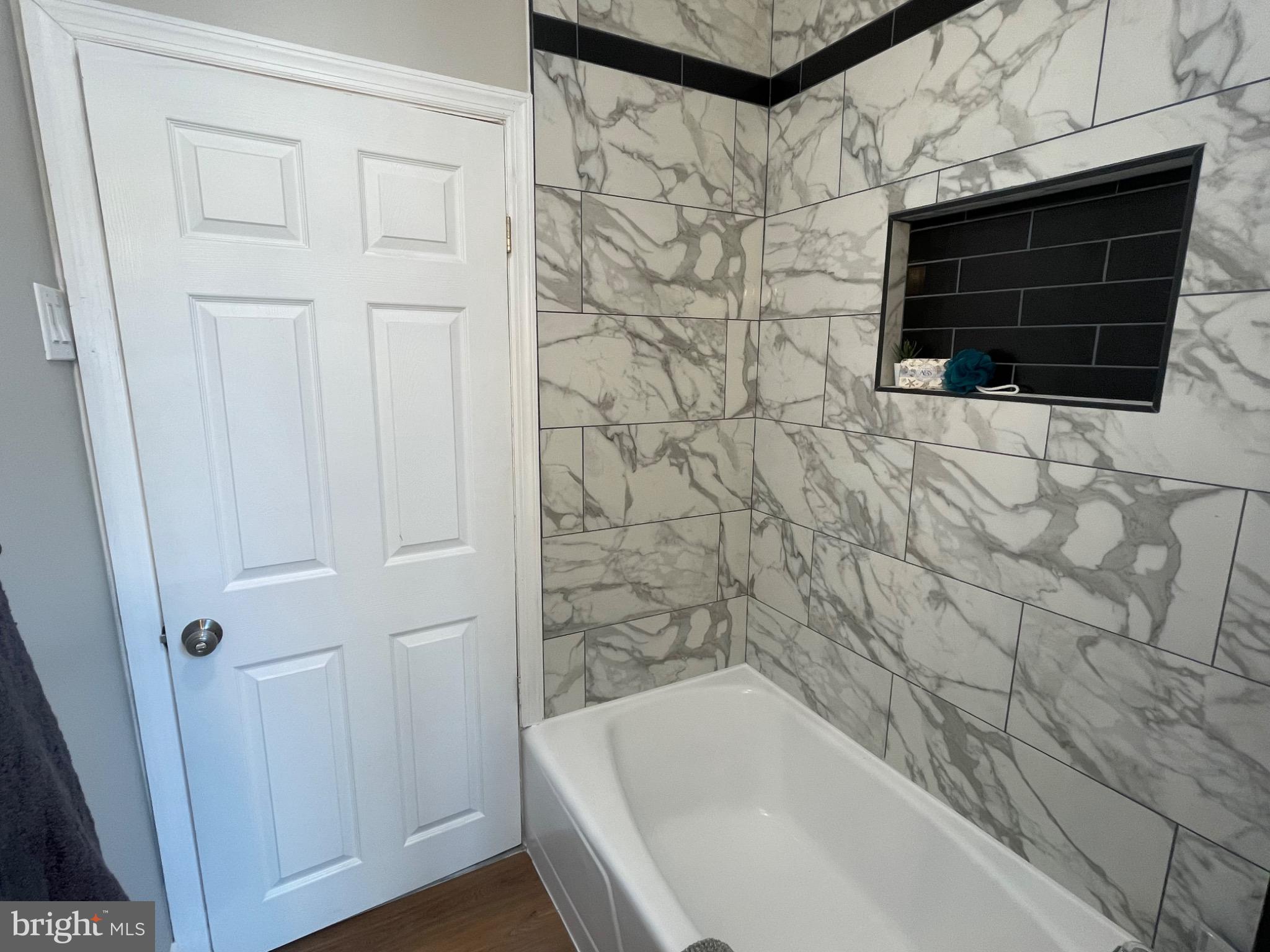 2301 Mosher Street Baltimore, MD 21216 - Photo 13 of 30 Elegant marble bath retreat with modern accents.