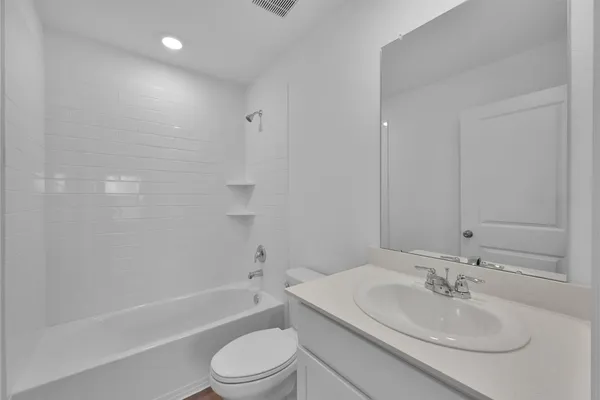 a bathroom with a sink toilet and a bathtub