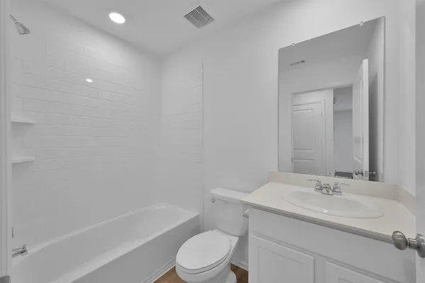a bathroom with a sink toilet and a bathtub