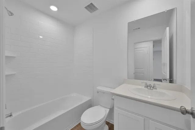 a bathroom with a sink toilet and a bathtub