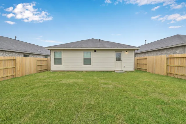 a view of a backyard of the house