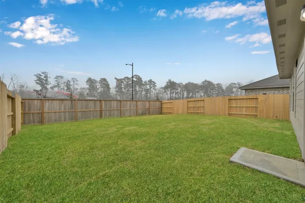 a view of a garden with a lake view