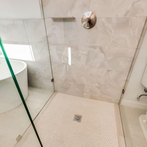 4337 Canal Street Dallas, TX 75210 - Photo 16 of 24 a bathroom with a tub sink and shower