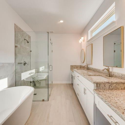4337 Canal Street Dallas, TX 75210 - Photo 18 of 24 a bathroom with a granite countertop sink and mirror with bathtub