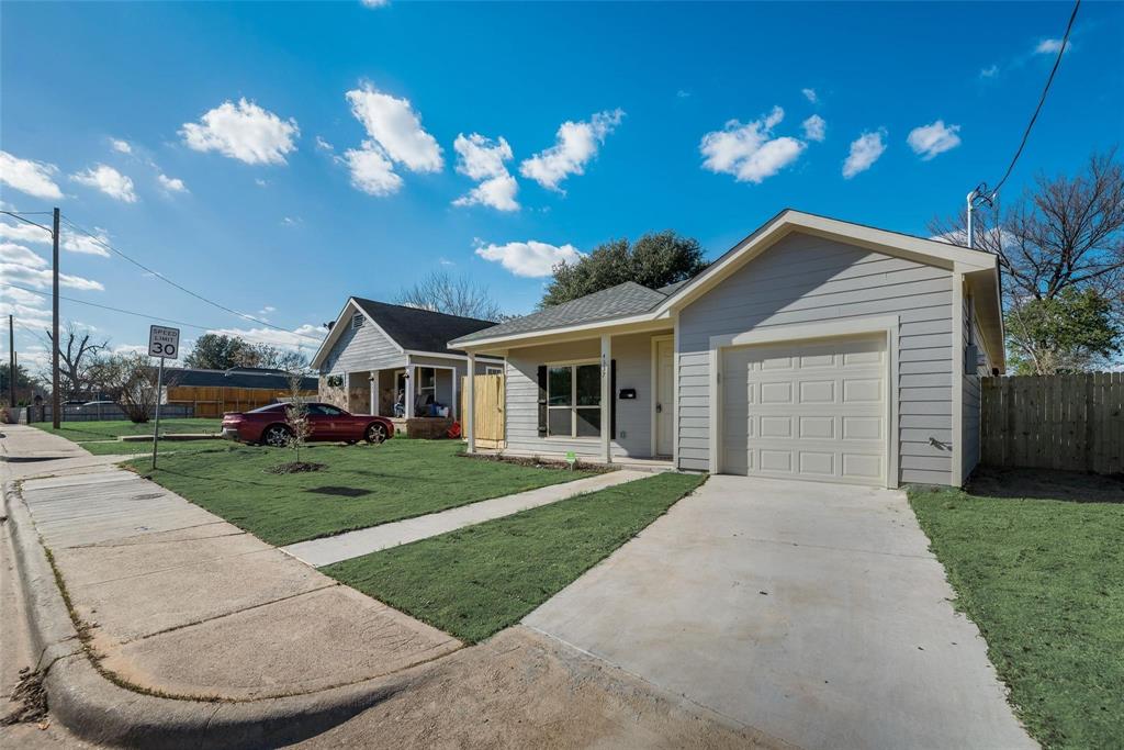 4337 Canal Street Dallas, TX 75210 - Photo 2 of 24 a front view of a house with a yard