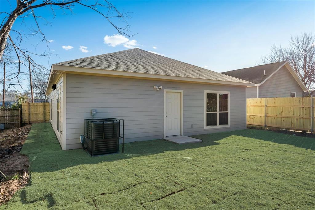 4337 Canal Street Dallas, TX 75210 - Photo 23 of 24 a front view of a house with a yard