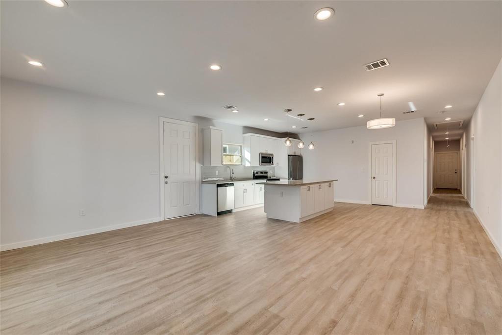 4337 Canal Street Dallas, TX 75210 - Photo 7 of 24 a view of kitchen with kitchen island and stainless steel appliances