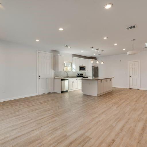 4337 Canal Street Dallas, TX 75210 - Photo 10 of 24 a view of kitchen with wooden floor