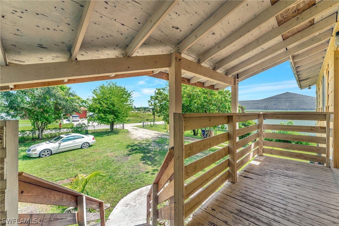 3809 4th Street Southwest Lehigh Acres, FL 33976 - Photo 11 of 34 a view of a porch and garden