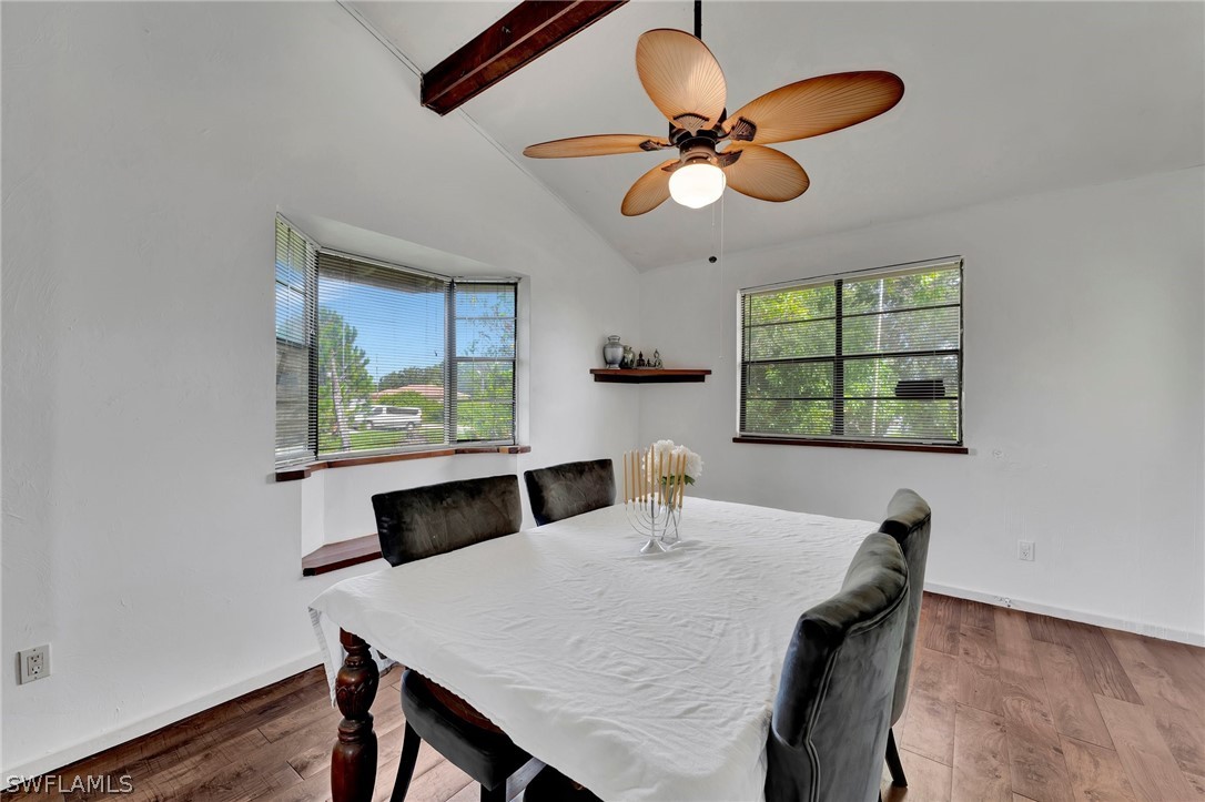 3809 4th Street Southwest Lehigh Acres, FL 33976 - Photo 13 of 34 a view of a dining room with a table and chairs