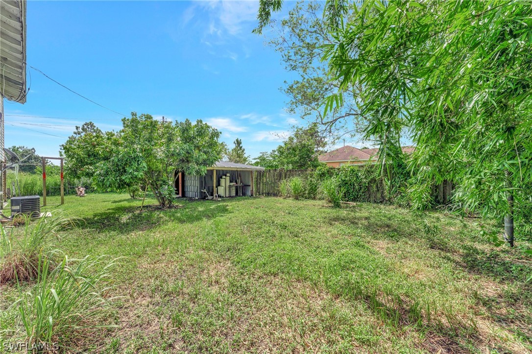 3809 4th Street Southwest Lehigh Acres, FL 33976 - Photo 34 of 34 a view of a house with a yard