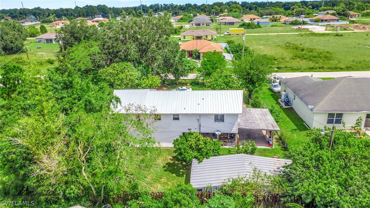 3809 4th Street Southwest Lehigh Acres, FL 33976 - Photo 5 of 34 an aerial view of a house with a garden