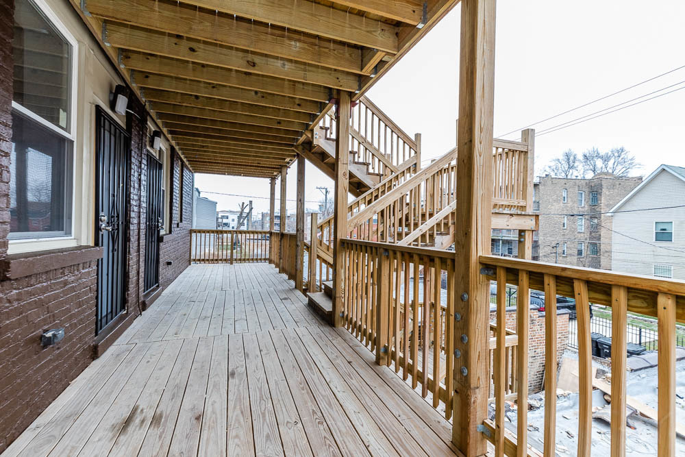 1411 East 67th Place, Unit 2W Chicago, IL 60637 - Photo 14 of 14 a view of a balcony with wooden floor