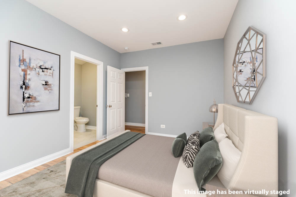 1411 East 67th Place, Unit 2W Chicago, IL 60637 - Photo 6 of 14 a bedroom with a bed and a painting on the wall