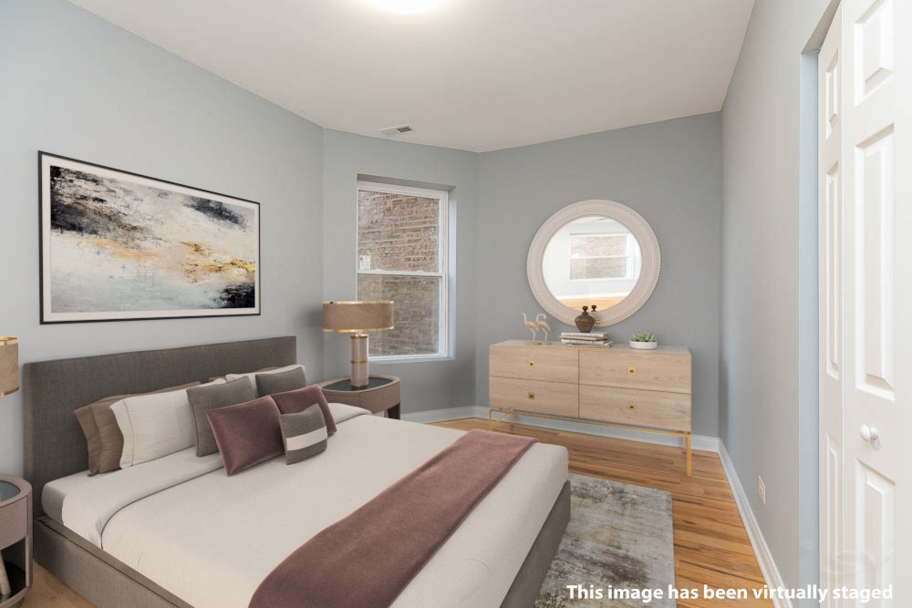 1411 East 67th Place, Unit 2W Chicago, IL 60637 - Photo 8 of 14 a bedroom with a bed and a painting on the wall