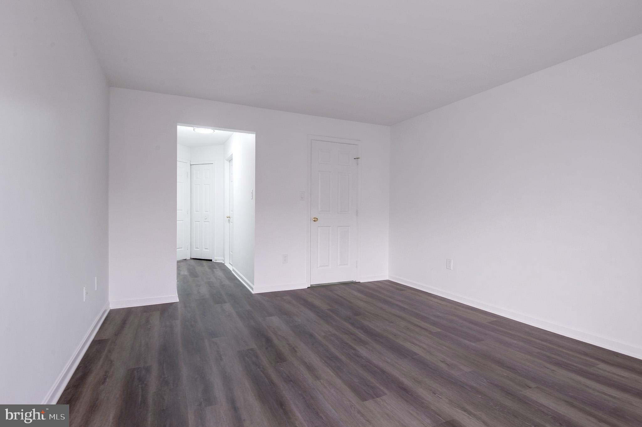 20600 Cornstalk Terrace, Unit 202 Ashburn, VA 20147 - Photo 18 of 31 a view of wooden floor in a room