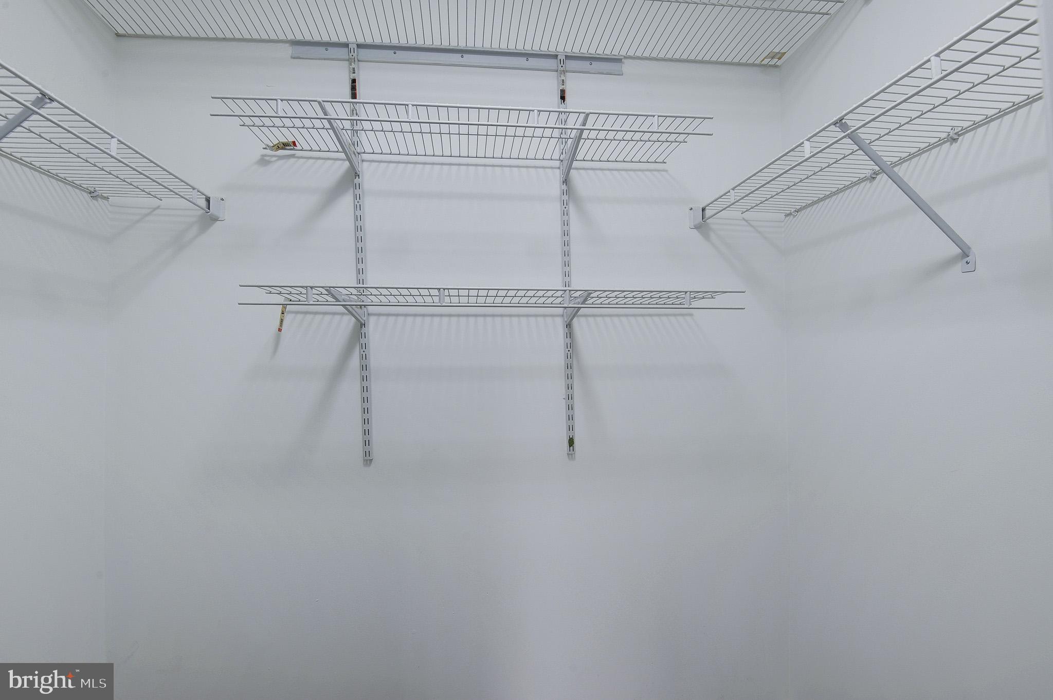 20600 Cornstalk Terrace, Unit 202 Ashburn, VA 20147 - Photo 28 of 31 a view of a room with racks on the wall