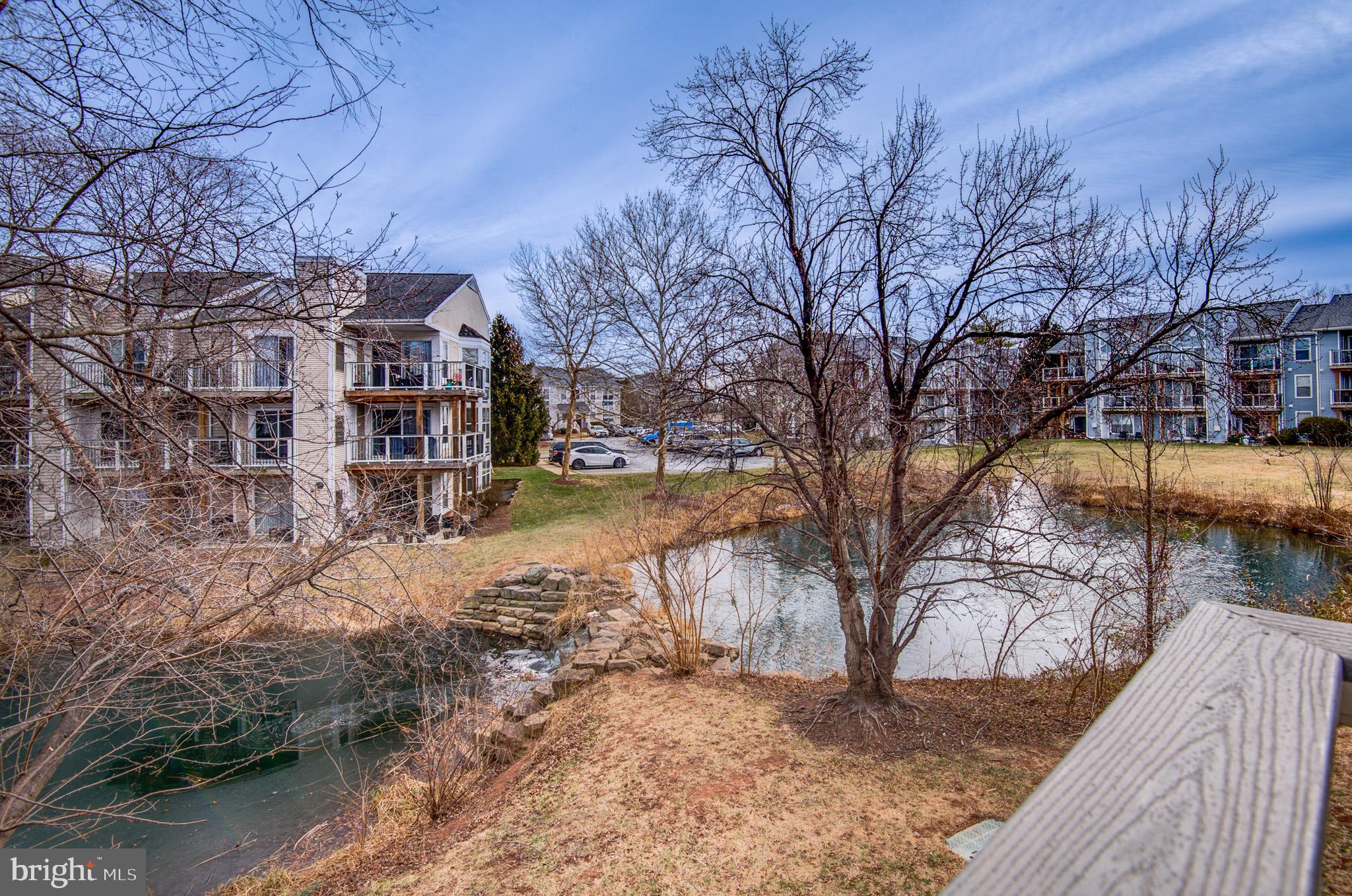 20600 Cornstalk Terrace, Unit 202 Ashburn, VA 20147 - Photo 31 of 31 a view of residential houses with snow in the yard