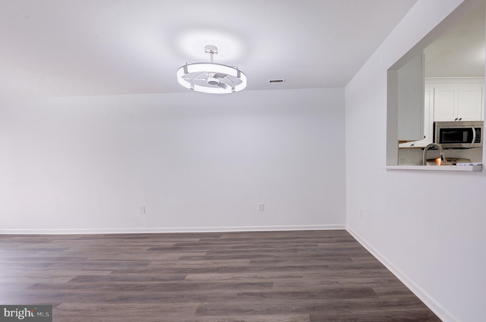 20600 Cornstalk Terrace, Unit 202 Ashburn, VA 20147 - Photo 8 of 31 a view of kitchen with wooden floor