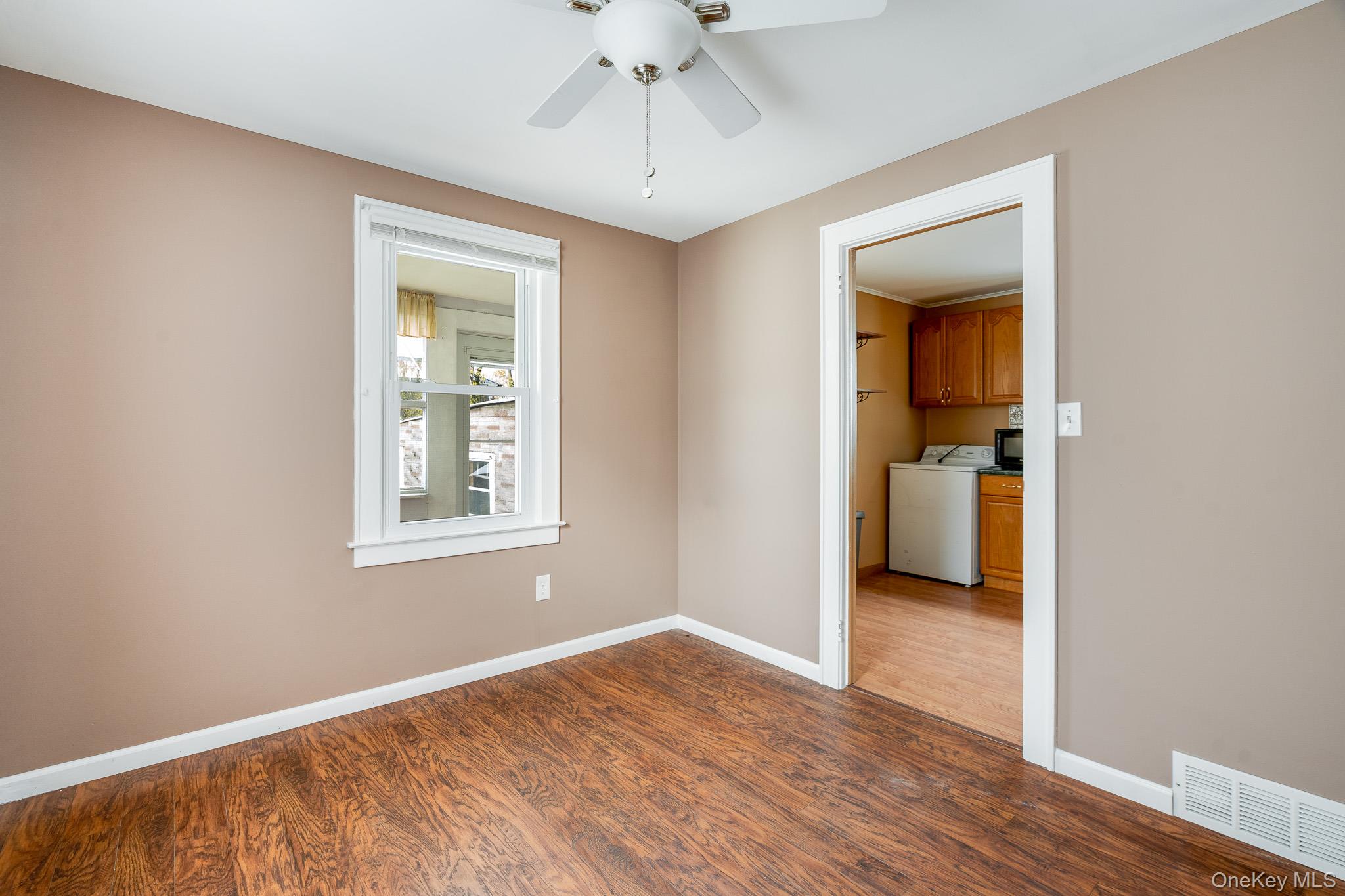 36 Spruce Street Poughkeepsie, NY 12601 - Photo 13 of 30 wooden floor in an empty room with a window