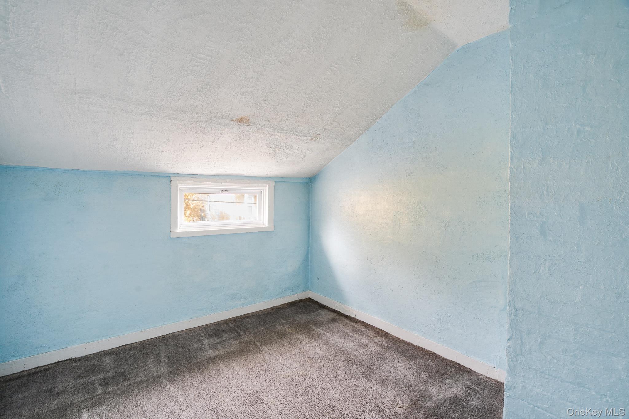 36 Spruce Street Poughkeepsie, NY 12601 - Photo 17 of 30 an empty room with a window