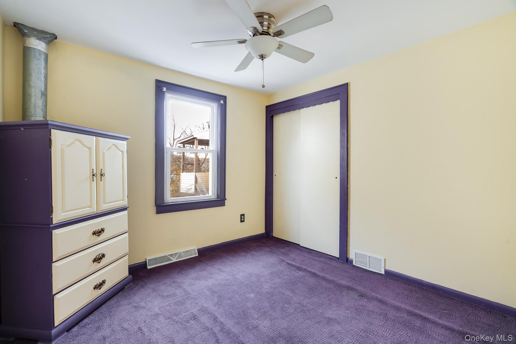36 Spruce Street Poughkeepsie, NY 12601 - Photo 7 of 30 a view of an empty room with cabinet and window