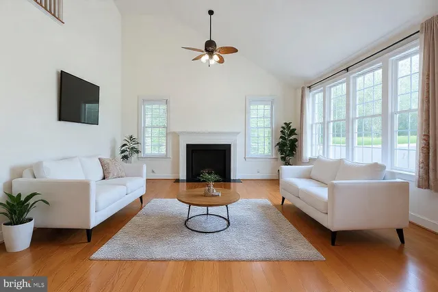 a kitchen with granite countertop a refrigerator and a stove top oven