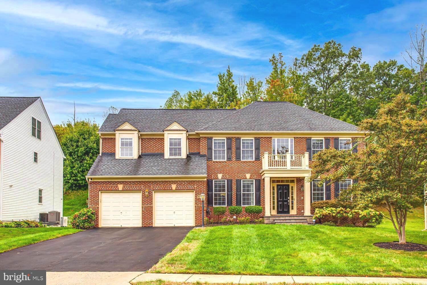3403 Logstone Drive Triangle, VA 22172 - Photo 3 of 66 a front view of a house with a yard