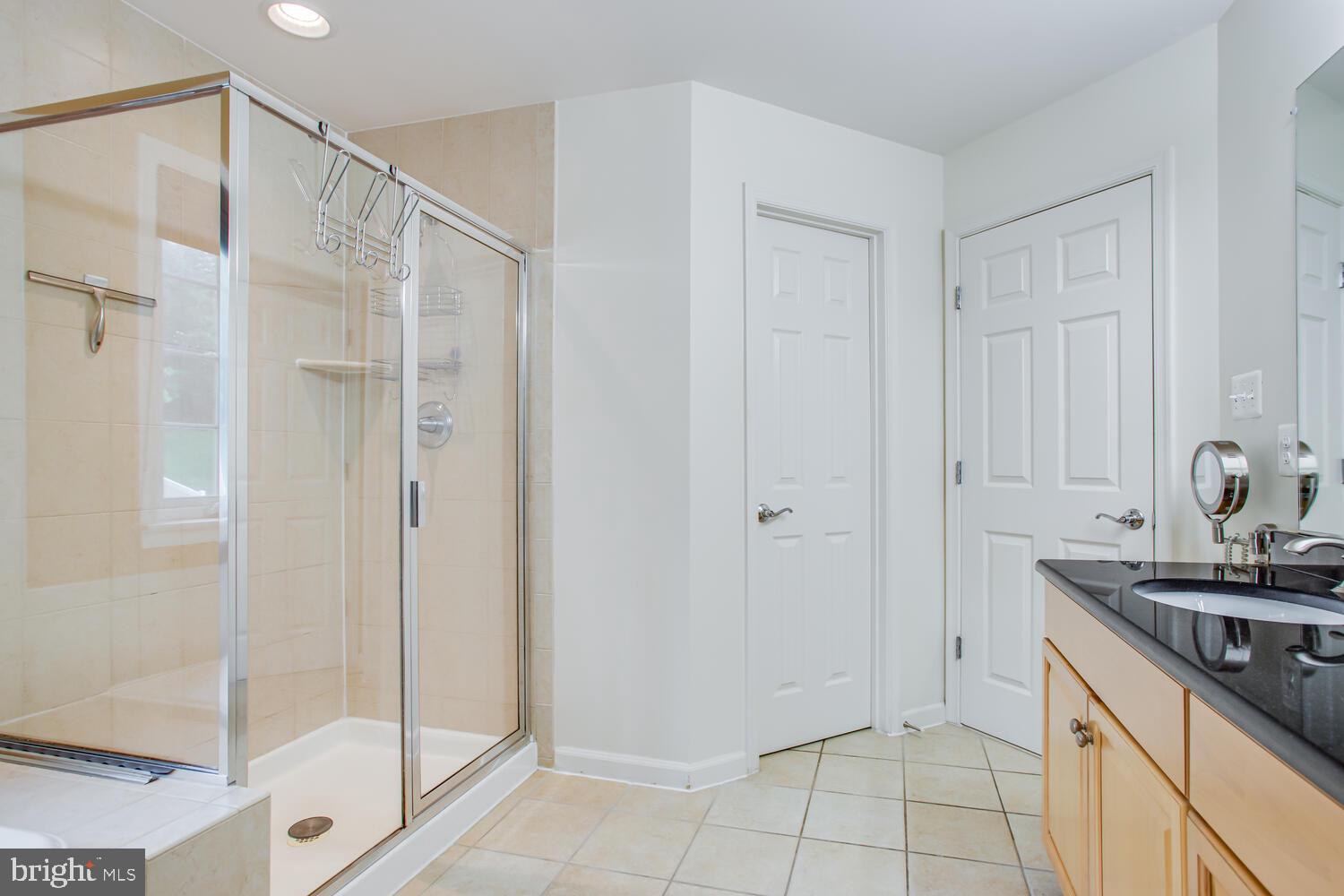3403 Logstone Drive Triangle, VA 22172 - Photo 36 of 66 a bathroom with a shower and a sink